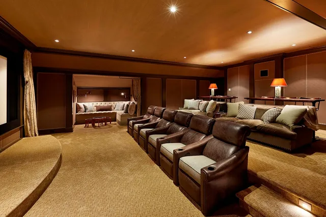 Home theater with leather recliners and a projection screen